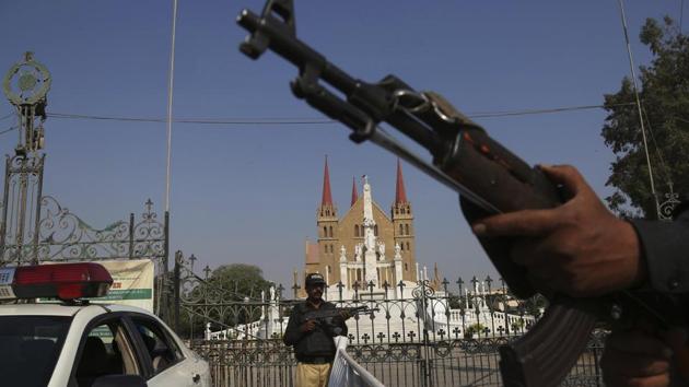 Pakistani police officers stand guard outside Saint Patrick’s Cathedral in Karachi, Pakistan. “I feel comfortable when I see security guards at the mosque gate and their presence brings tranquility while praying,” said Fadhil al-Kinani, a 45-year old owner of a construction materials shop in Baghdad’s eastern district of Sadr City, who performs the five daily prayer services in a nearby mosque. (Shakil Adil / AP)
