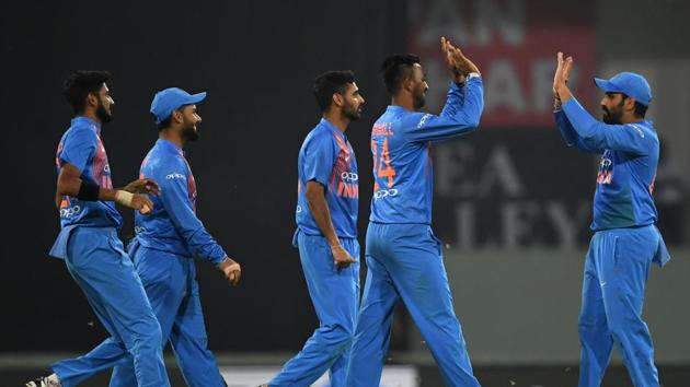 Indian players celebrate the fall of a West Indies wicket in Lucknow on Tuesday. (AFP) Indian players celebrate the fall of a West Indies wicket in Lucknow on Tuesday. (AFP)