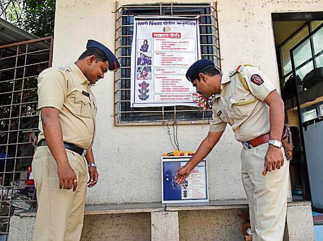 Police officials checking a complaint box at Sindhu park society in Pimple Saudagar in Pune on Wednesday. (HT PHOTO) Police officials checking a complaint box at Sindhu park society in Pimple Saudagar in Pune on Wednesday. (HT PHOTO)