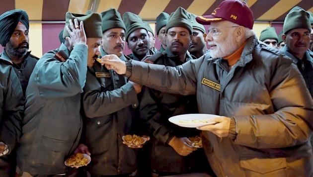 Greeting jawans in Harshil cantonment area, PM Narendra Modi said they are securing the future and dreams of 125 crore Indians and helping spread a sense of security and fearlessness among people.(PTI)