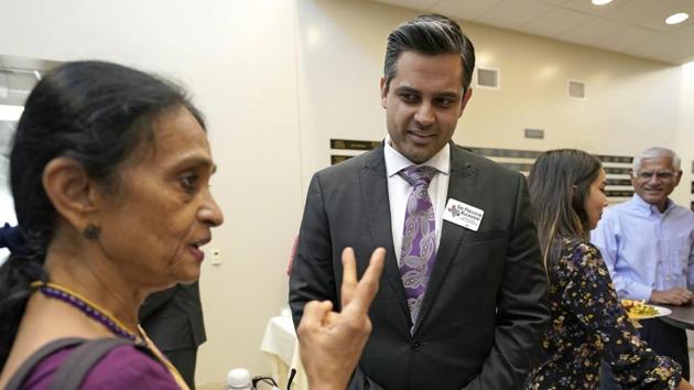 Democrat for Congress candidate Sri Kulkarni, center, listens to supporters attending a fundraiser for him in Houston. Kulkarni lost to his GOP incumbent Pete Olson from the 22nd Congressional District of Texas.(AP File Photo)