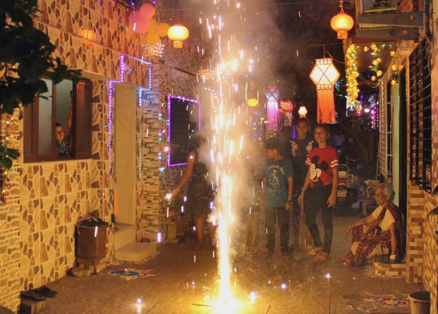 Children light crackers at Kalachowki on Tuesday.(Bhushan Koyande/HT)