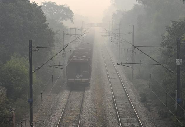 A train runs on a track with near-zero visibility ahead and around it (PTI)