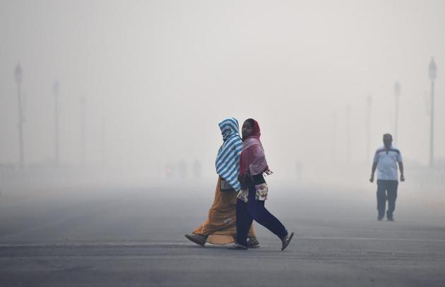 Women walk down Rajpath on the morning after Diwali (PTI)
