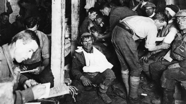 British tommies relaxing while others have their wounds treated in an underground forward dressing station by the Menin Road in France. (Frank Hurley / Three Lions / Getty Images) British tommies relaxing while others have their wounds treated in an underground forward dressing station by the Menin Road in France. (Frank Hurley / Three Lions / Getty Images)