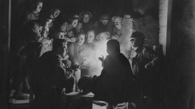 Circa 1916: British soldiers sitting around a lamp in their trench. (Hulton Archive / Getty Images) Circa 1916: British soldiers sitting around a lamp in their trench. (Hulton Archive / Getty Images)