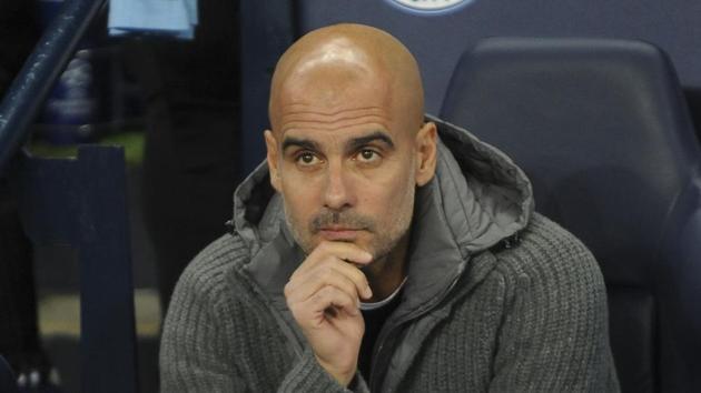 Manchester City coach Pep Guardiola looks on before the Champions League Group F soccer match between Manchester City and Shakhtar Donetsk at Etihad stadium.(AP)