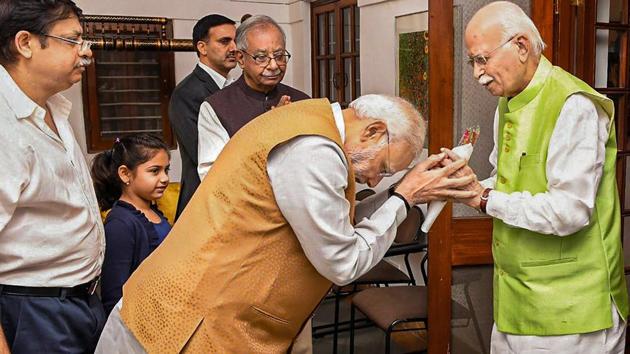 Prime Minister Narendra Modi greets BJP senior leader L K Advani on his birthday at his residence, in New Delhi. (PTI) Prime Minister Narendra Modi greets BJP senior leader L K Advani on his birthday at his residence, in New Delhi. (PTI)