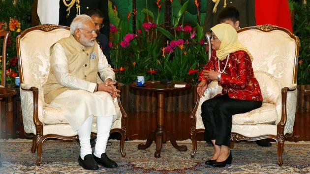 PM Narendra Modi with Singapore’s President Halimah Yacob at the Istana in Singapore (Reuters) PM Narendra Modi with Singapore’s President Halimah Yacob at the Istana in Singapore (Reuters)