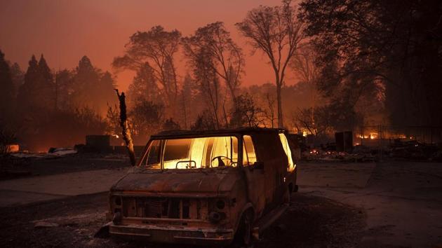 Flames burn inside a van as the Camp Fire tears through Paradise, California. Tens of thousands fled a fast-moving wildfire Thursday in Northern California, some clutching babies and pets as they abandoned vehicles and struck out on foot ahead of the flames that forced the evacuation of an entire town and destroyed hundreds of structures. (Noah Berger / AP) Flames burn inside a van as the Camp Fire tears through Paradise, California. Tens of thousands fled a fast-moving wildfire Thursday in Northern California, some clutching babies and pets as they abandoned vehicles and struck out on foot ahead of the flames that forced the evacuation of an entire town and destroyed hundreds of structures. (Noah Berger / AP)