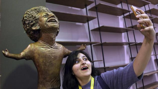 A participant at an international youths gathering poses for selfie with a bronze statue of Liverpool striker Mohammed Salah in a conference hall, in Sharm El Sheikh, Egypt. The statue kicked up a social media storm because of its poor resemblance. It depicts Salah with a disproportionately large head and baby arms stretched in the celebratory pose. (Ayman Aref / AP) A participant at an international youths gathering poses for selfie with a bronze statue of Liverpool striker Mohammed Salah in a conference hall, in Sharm El Sheikh, Egypt. The statue kicked up a social media storm because of its poor resemblance. It depicts Salah with a disproportionately large head and baby arms stretched in the celebratory pose. (Ayman Aref / AP)
