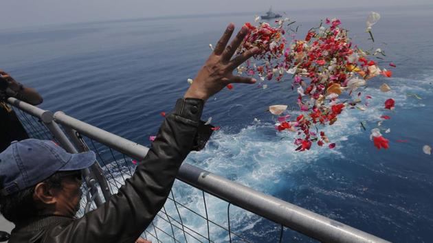 A relative sprinkles flowers for the victims of the crashed Lion Air flight 610 from an Indonesian Navy ship in the waters where the plane is believed to have crashed in Tanjung Karawang, Indonesia. (Tatan Syuflana / AP) A relative sprinkles flowers for the victims of the crashed Lion Air flight 610 from an Indonesian Navy ship in the waters where the plane is believed to have crashed in Tanjung Karawang, Indonesia. (Tatan Syuflana / AP)