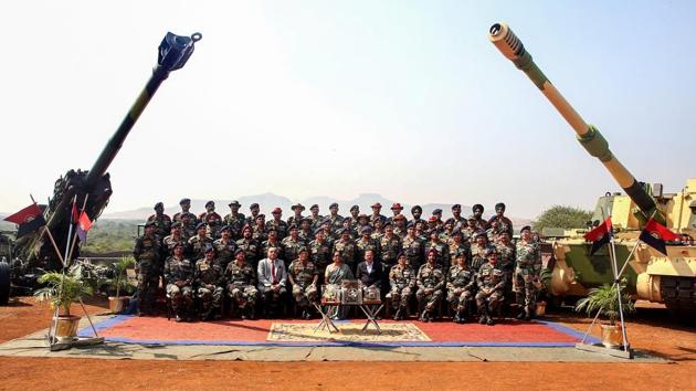 Defence minister Nirmala Sitharaman, Army Chief General Bipin Rawat and others pose for a group photograph during a ceremony at Deolali artillery centre, in Nashik district on  November 9. (PTI Photo)