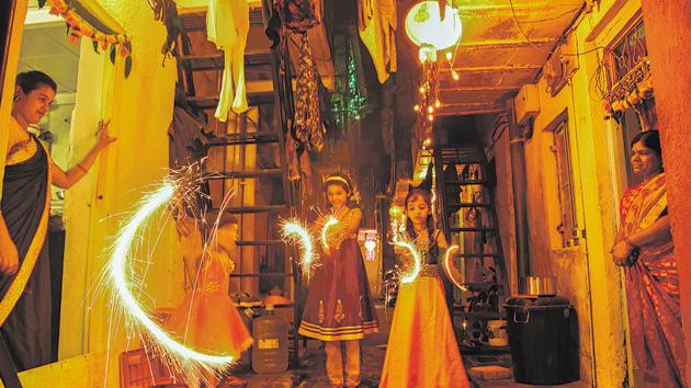 People seen in a festive mood as they celebrate Diwali by bursting firecrackers in Kothrud on Wednesday. (Sanket Wankhade/HT PHOTO) People seen in a festive mood as they celebrate Diwali by bursting firecrackers in Kothrud on Wednesday. (Sanket Wankhade/HT PHOTO)