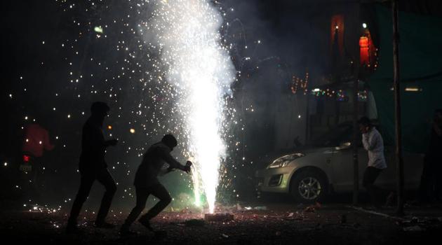 This picture shows People celebrating Diwali festival at Market yard in Pune. (HT Photo) This picture shows People celebrating Diwali festival at Market yard in Pune. (HT Photo)