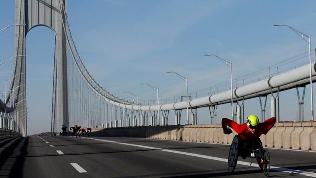 Athletes in the Professional Wheelchair Divison crossing the Verrazzano Bridge during the New York City Marathon, in New York City. (Andrew Kelly / REUTERS) Athletes in the Professional Wheelchair Divison crossing the Verrazzano Bridge during the New York City Marathon, in New York City. (Andrew Kelly / REUTERS)