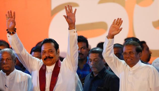 Sri Lanka's newly appointed Prime Minister Mahinda Rajapaksa and President Maithripala Sirisena wave at their supporters during a rally near the Parliament, Colombo, Sri Lanka, November 5, 2018 (REUTERS) Sri Lanka's newly appointed Prime Minister Mahinda Rajapaksa and President Maithripala Sirisena wave at their supporters during a rally near the Parliament, Colombo, Sri Lanka, November 5, 2018 (REUTERS)