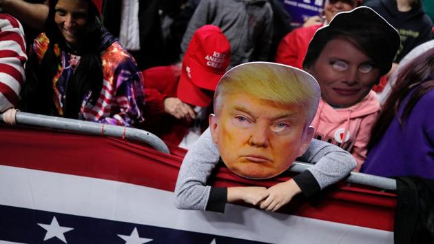 Supporters participate behind an image of US President Donald Trump at a campaign rally at the Allen County War Memorial Coliseum in Fort Wayne, Indiana. (Carlos Barria / REUTERS) Supporters participate behind an image of US President Donald Trump at a campaign rally at the Allen County War Memorial Coliseum in Fort Wayne, Indiana. (Carlos Barria / REUTERS)