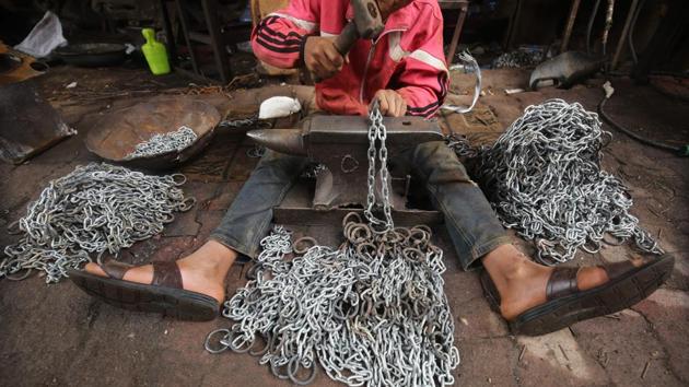 Ali Jawad, 12, who left school to support his family works in an iron chains industry workshop in Haifa street in the Iraqi capital Baghdad. (Ahmad Al-Rubaye / AFP) Ali Jawad, 12, who left school to support his family works in an iron chains industry workshop in Haifa street in the Iraqi capital Baghdad. (Ahmad Al-Rubaye / AFP)