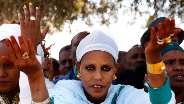 Israeli women from the Ethiopian Jewish community pray during the Sigd holiday marking the desire to ‘return to Jerusalem’, as they celebrate from a hilltop in the holy city overlooking the Temple Mount, in Jerusalem. (Gali Tibbon / AFP) Israeli women from the Ethiopian Jewish community pray during the Sigd holiday marking the desire to ‘return to Jerusalem’, as they celebrate from a hilltop in the holy city overlooking the Temple Mount, in Jerusalem. (Gali Tibbon / AFP)