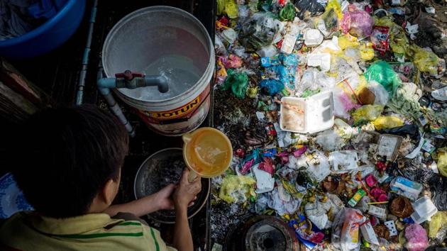 Some canal dwellers like Le Thi Thanh are fed up with the trash -- and stench -- and say they’d happily move. “People just throw trash and defecate in the canal, so we have to live with the pollution,” 61-year-old Thanh, who has been on Xuyen Tam canal for 20 years, told AFP. (Kao Nguyen / AFP)