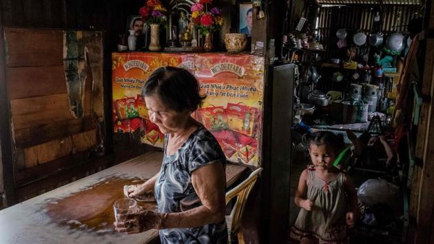 That worries grandmother Nguyen Thi My, who for the past 28 years has lived on the downtown Xuyen Tam canal, eking out a living selling snacks. “It’ll be a pity to move. I know this area well... and it’s good for business,” she told AFP from her busy home where she lives with family. (Kao Nguyen / AFP)