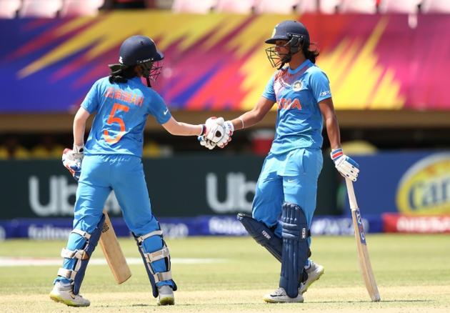 Harmanpreet Kaur (R) shakes hands with Jemimah Rodrigues after the latter completes her half-century in the ICC Women’s WT20 opener. (ICC/ Twitter) Harmanpreet Kaur (R) shakes hands with Jemimah Rodrigues after the latter completes her half-century in the ICC Women’s WT20 opener. (ICC/ Twitter)