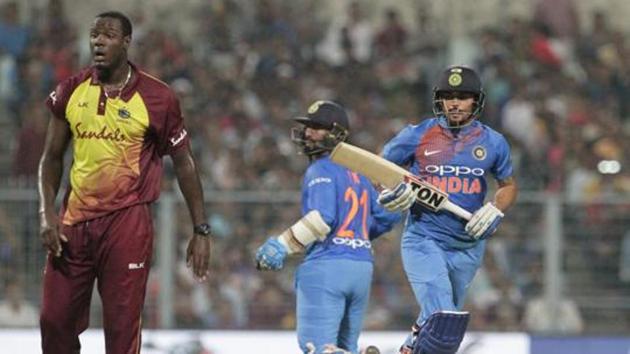 West Indies' captain Carlos Brathwaite, left, reacts as India's Manish Pandey, right, and Dinesh Karthik run between the wickets as during the first Twenty20 international cricket match between India and West Indies in Kolkata. (AP) West Indies' captain Carlos Brathwaite, left, reacts as India's Manish Pandey, right, and Dinesh Karthik run between the wickets as during the first Twenty20 international cricket match between India and West Indies in Kolkata. (AP)