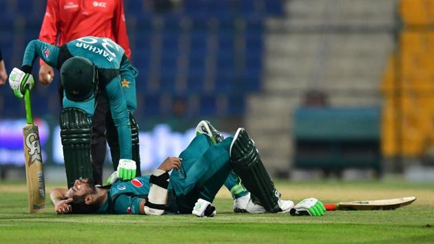 Pakistan cricketer Fakhar Zaman checks his teammate Pakistan cricketer Imam Ul-Haq as he lies on the pitch after being hit by a ball during the second one day international (ODI) cricket match between Pakistan and New Zealand(AFP) Pakistan cricketer Fakhar Zaman checks his teammate Pakistan cricketer Imam Ul-Haq as he lies on the pitch after being hit by a ball during the second one day international (ODI) cricket match between Pakistan and New Zealand(AFP)