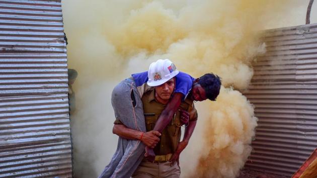 A firefighter carries out rescue work during a mock drill organised as part of preparedness for upcoming Kumbh Mela at Sangam, in Prayagraj. (PTI) A firefighter carries out rescue work during a mock drill organised as part of preparedness for upcoming Kumbh Mela at Sangam, in Prayagraj. (PTI)