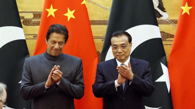 Pakistani Prime Minister Imran Khan and China's Premier Li Keqiang attend a signing ceremony at the Great Hall of the People in Beijing on November 3. (AP Photo) Pakistani Prime Minister Imran Khan and China's Premier Li Keqiang attend a signing ceremony at the Great Hall of the People in Beijing on November 3. (AP Photo)