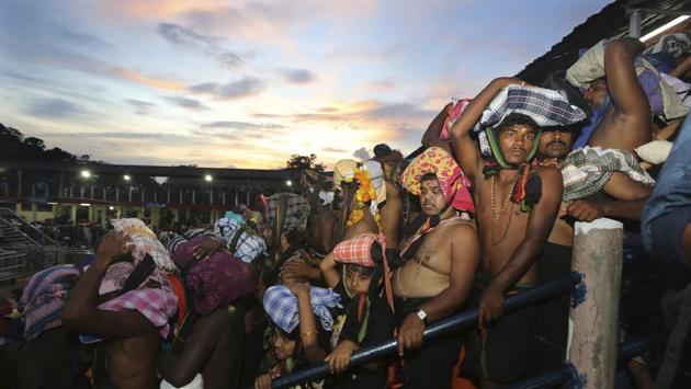 Devotees carrying customary offerings on their heads, wait to worship at the Sabarimala temple in Kerala. The historic temple which had barred women age 10 to 50 from entering the temple, had opened to Hindu pilgrims for a day Monday evening. (Manish Swarup / AP) Devotees carrying customary offerings on their heads, wait to worship at the Sabarimala temple in Kerala. The historic temple which had barred women age 10 to 50 from entering the temple, had opened to Hindu pilgrims for a day Monday evening. (Manish Swarup / AP)
