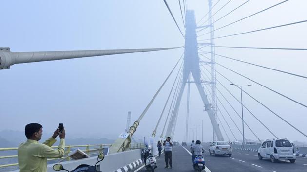 People take pictures of Signature Bridge on the first day of its opening to the public, at Wazirabad, in New Delhi. (Sanchit Khanna / HT Photo) People take pictures of Signature Bridge on the first day of its opening to the public, at Wazirabad, in New Delhi. (Sanchit Khanna / HT Photo)
