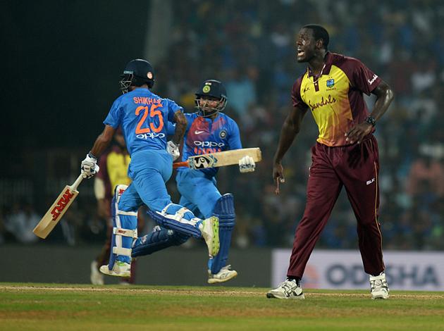 West Indies cricket captain Carlos Barthwaite (R) reacts as Indian cricketer Rishabh Pant (C), Shikhar Dhawan (L) runs across wicket during the Third T20 cricket match between India and West Indies at the MA Chidambaram Cricket Stadium in Chennai. (AFP) West Indies cricket captain Carlos Barthwaite (R) reacts as Indian cricketer Rishabh Pant (C), Shikhar Dhawan (L) runs across wicket during the Third T20 cricket match between India and West Indies at the MA Chidambaram Cricket Stadium in Chennai. (AFP)