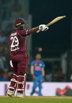 West Indies cricketer Nicholas Pooran celebrates after scoring a half century (50 runs) during the Third T20 cricket match between India and West Indies at the M.A. Chidambaram Cricket Stadium in Chennai (AFP) West Indies cricketer Nicholas Pooran celebrates after scoring a half century (50 runs) during the Third T20 cricket match between India and West Indies at the M.A. Chidambaram Cricket Stadium in Chennai (AFP)