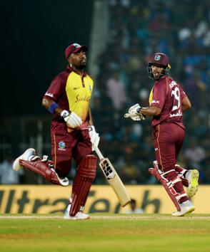 West Indies cricketer Nicholas Pooran (R) runs between the wickets during the third T20 cricket match between India and West Indies at the M.A. Chidambaram Cricket Stadium in Chennai. (AFP) West Indies cricketer Nicholas Pooran (R) runs between the wickets during the third T20 cricket match between India and West Indies at the M.A. Chidambaram Cricket Stadium in Chennai. (AFP)