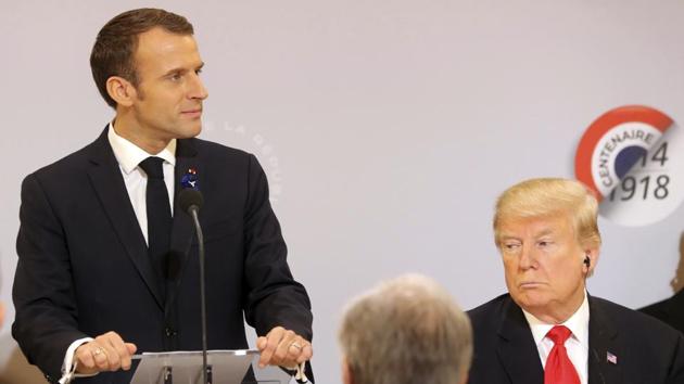 French President Emmanuel Macron delivers a speech while President Donald Trump looks on before a lunch at the Elysee Palace, in Paris, as part of the commemorations marking the 100th anniversary of the 11 November 1918 armistice, ending World War I on November 11.(AP Photo)