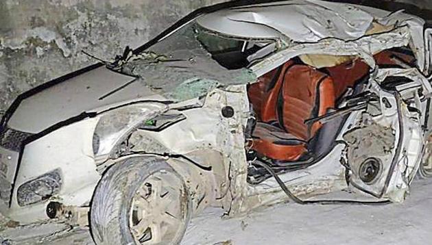The Swift Dzire in which the trio was travelling rammed into a tree after colliding with a car and flipped, the police said. (HT Photo) The Swift Dzire in which the trio was travelling rammed into a tree after colliding with a car and flipped, the police said. (HT Photo)