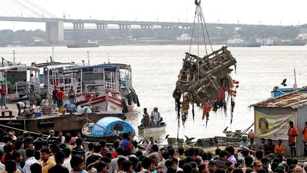 Corporation workers collecting the remnants of the goddess Durga idols after immersion to avoid pollution of river Ganga in Kolkata after the end of Durga puja celebrations(PTI) Corporation workers collecting the remnants of the goddess Durga idols after immersion to avoid pollution of river Ganga in Kolkata after the end of Durga puja celebrations(PTI)