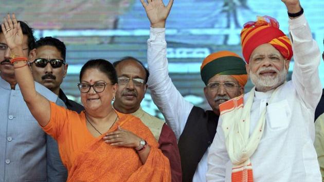 Prime Minister Narendra Modi and Rajasthan chief minister Vasundhara Raje greet their supporters during 'Vijay Sankalp Sabha', in Ajmer on October 6. (PTI Photo) Prime Minister Narendra Modi and Rajasthan chief minister Vasundhara Raje greet their supporters during 'Vijay Sankalp Sabha', in Ajmer on October 6. (PTI Photo)