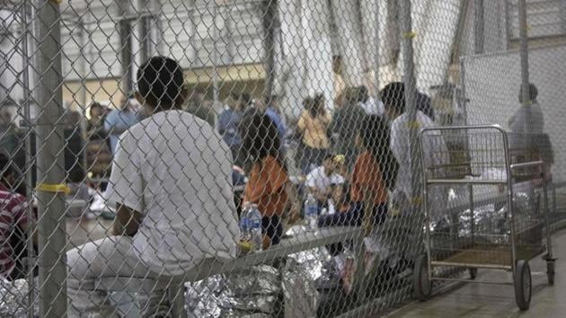 US Customs and Border Protection photo shows intake of illegal border crossers by US Border Patrol agents at the Central Processing Center in McAllen, Texas on May 23. (AFP File Photo/Representative image) US Customs and Border Protection photo shows intake of illegal border crossers by US Border Patrol agents at the Central Processing Center in McAllen, Texas on May 23. (AFP File Photo/Representative image)
