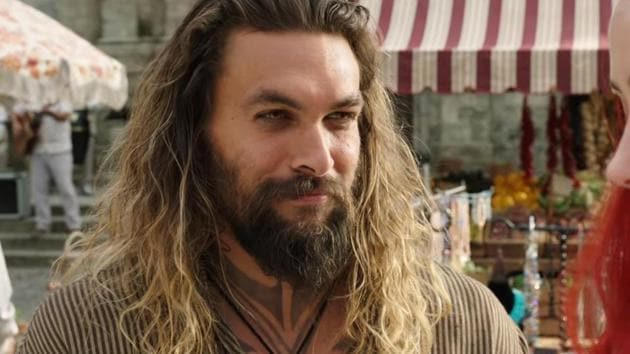 Jason Momoa stars in and as Aquaman. The film releases on December 14.