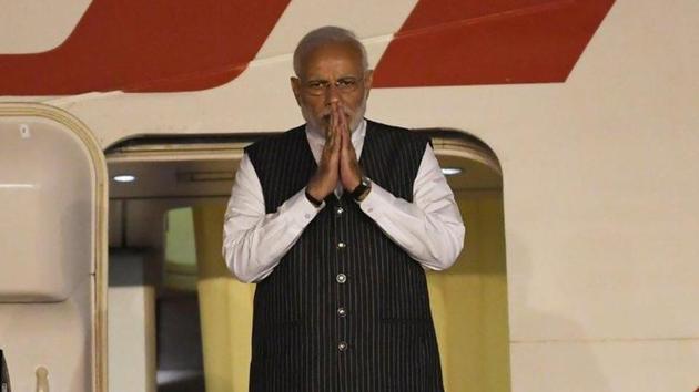 Prime Minister Narendra Modi embarks on the plane to leave for Singapore on November 13.(Twitter/PMO)