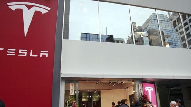 A 32-year-old Indian man, a former employee at American electric car manufacturer Tesla, has been charged for allegedly stealing USD 9.3 million (67, 55, 75, 250 INR) from the company.(AP)