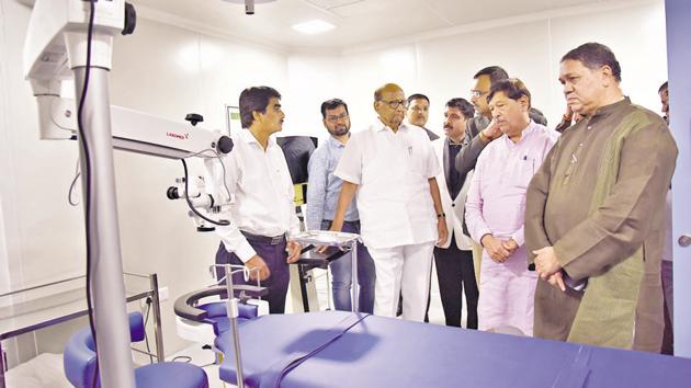 (From right) Dilip Valse Patil, member of the Maharashtra legislative assembly; Girish Bapat; guardian minister and Sharad Pawar , president of the Nationalist Congress Party tour Dattatray Walse Patil multi-specialty eye hospital after inaugurating it in Bopodi on Sunday. This project is said to be a one-of- its kind as this is the first eye care hospital being built by the local health body of a corporation in India. The hospital will be run in a private-public partnership with Vision Next foundation”, said Dr Ambarish Darak, chief of the hospital and Vision Next foundation, a charitable trust. (HT PHOTO) (From right) Dilip Valse Patil, member of the Maharashtra legislative assembly; Girish Bapat; guardian minister and Sharad Pawar , president of the Nationalist Congress Party tour Dattatray Walse Patil multi-specialty eye hospital after inaugurating it in Bopodi on Sunday. This project is said to be a one-of- its kind as this is the first eye care hospital being built by the local health body of a corporation in India. The hospital will be run in a private-public partnership with Vision Next foundation”, said Dr Ambarish Darak, chief of the hospital and Vision Next foundation, a charitable trust. (HT PHOTO)