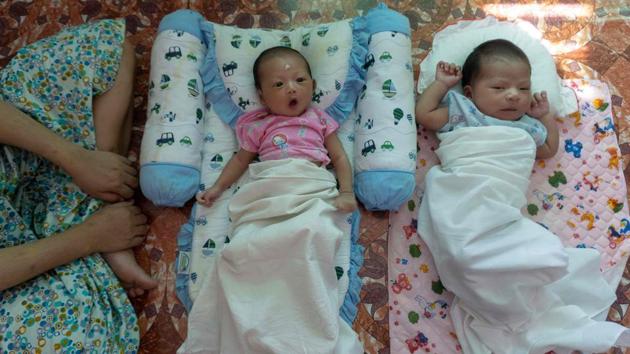 Babies of unmarried women seen at the Myint Mo Myittar Single Mothers' Foundation in Yangon. More than 100 girls and women pass through the doors of the centre, which provides a home for those in the last few months of their pregnancy and for 45 days after giving birth and provides refuge to single mothers away from the disparaging eyes of their neighbours and the chastisement of their families. (Phyo Hein Kyaw / AFP) Babies of unmarried women seen at the Myint Mo Myittar Single Mothers' Foundation in Yangon. More than 100 girls and women pass through the doors of the centre, which provides a home for those in the last few months of their pregnancy and for 45 days after giving birth and provides refuge to single mothers away from the disparaging eyes of their neighbours and the chastisement of their families. (Phyo Hein Kyaw / AFP)