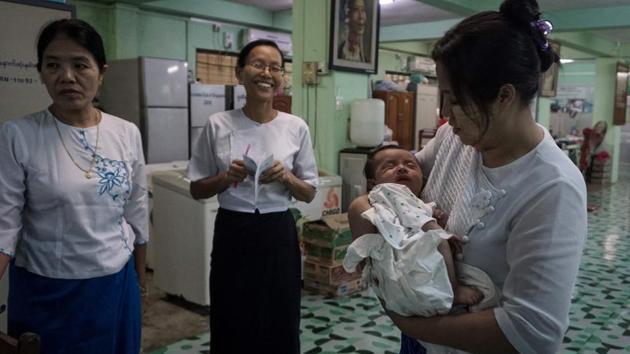 Doctor Myat Sandar Thant has the grim task of handing over unwanted babies born in her centre to a government-run Yangon orphanage. Myanmar’s strict adoption regulations mean most infants here will spend their whole childhood in state care. “This is the best that is available in Myanmar,” she said. “But the children lose their sparkling eyes,” added the doctor. (Phyo Hein Kyaw / AFP) Doctor Myat Sandar Thant has the grim task of handing over unwanted babies born in her centre to a government-run Yangon orphanage. Myanmar’s strict adoption regulations mean most infants here will spend their whole childhood in state care. “This is the best that is available in Myanmar,” she said. “But the children lose their sparkling eyes,” added the doctor. (Phyo Hein Kyaw / AFP)