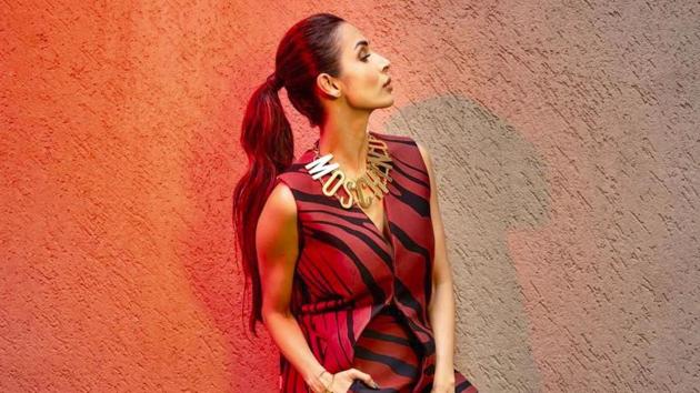 Malaika Arora wore the animal print trend to perfection, pairing the look with a metallic choker and the perfect red pout. (Instagram)