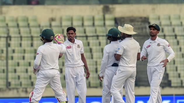 Bangladesh players celebrate the fall of a Zimbabwe wicket on Wednesday.(AFP)