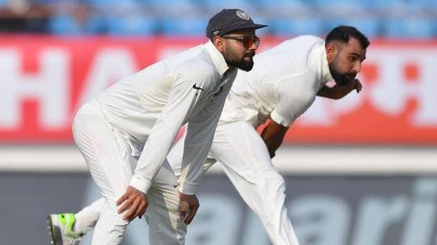 File image - India's captain Virat Kohli (L) looks on as teammate Mohammed Shami bowls during a Test match.(AFP)